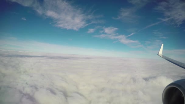 Airplane flying just above the clouds — Stock Video