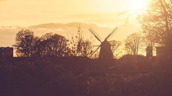 Windmill silhouette panoramic view at sunset — Stock Photo, Image