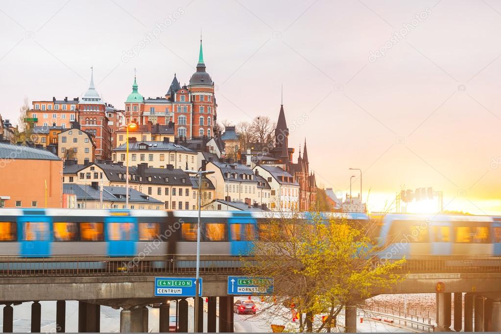 Stockholm, view of buildings and train at dusk