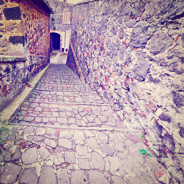 Narrow Alley with Old Buildings in Italian City of Torre Alfina, Instagram Effect