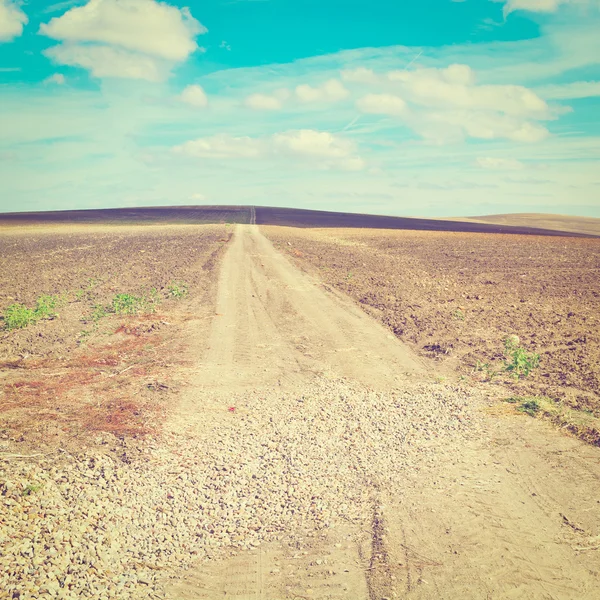 Onverharde weg — Stockfoto