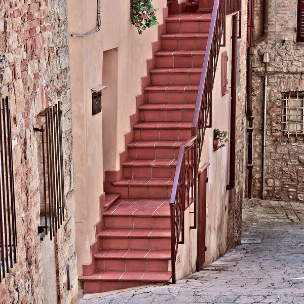 Narrow Alley with Old Buildings in Italian City of Volterra, Vintage Style Toned Picture