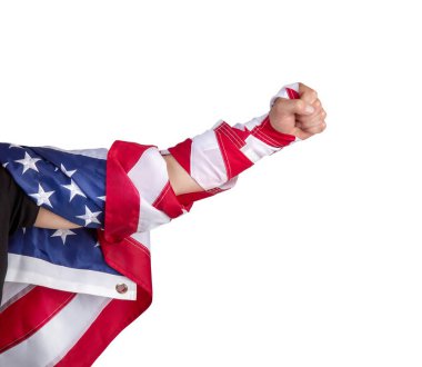 Strong male arm wrapped in the Stars and Stripes USA flag strikes forward