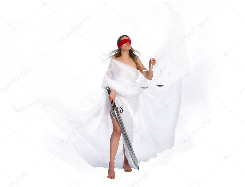 The ancient goddess of justice Themis in fluttering white robes, blindfolded, sword in one hand and scales in the other. The symbol of the impartiality of the court 