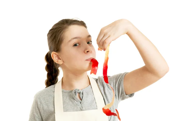 The girl holds in hand a peel Stock Image