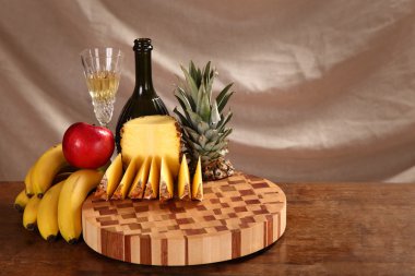 fruit and wine on a chopping board