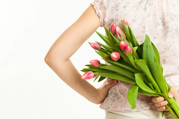 The girl holds a bouquet of tulips — Stock Photo, Image
