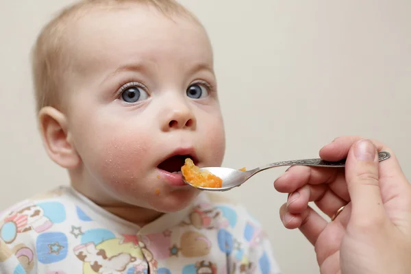 Baby boy has dinner — Stock Photo, Image
