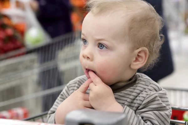 Boy in shopping cart — Stock Photo, Image