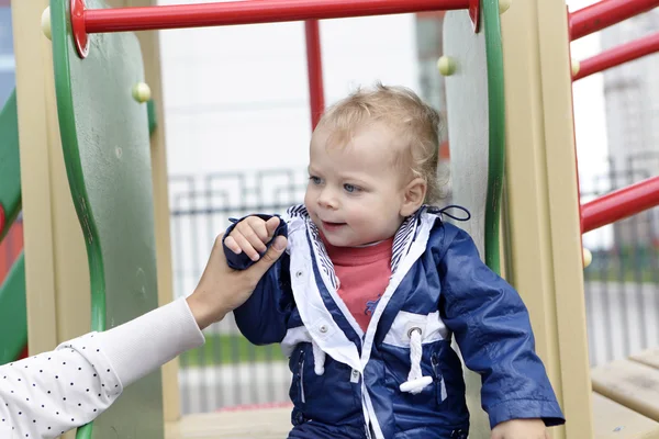 Mother holding toddler hand — Stock Photo, Image