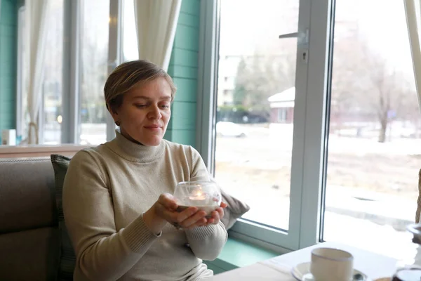 Woman Holding Candle Her Hands Cafe — Stock Photo, Image