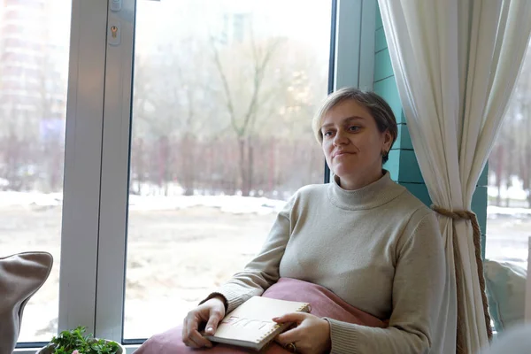 Portrait Dreaming Woman Notepad Window Sill — Stock Photo, Image