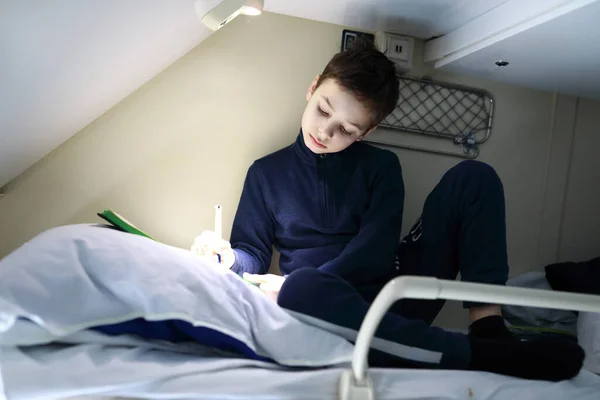 Boy Drawing Top Shelf Train Compartment — Stock Photo, Image