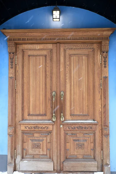 Wooden door lit by lantern, Kazan, Russia