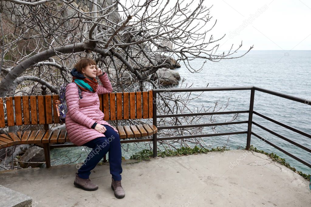 Woman on a bench at Chekhov's dacha in spring, Gurzuf, Crimea