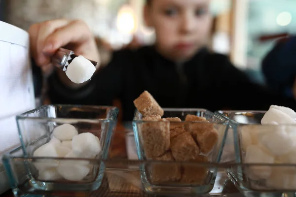 Boy Taking Piece Sugar Tongs Restaurant — Stock Photo, Image