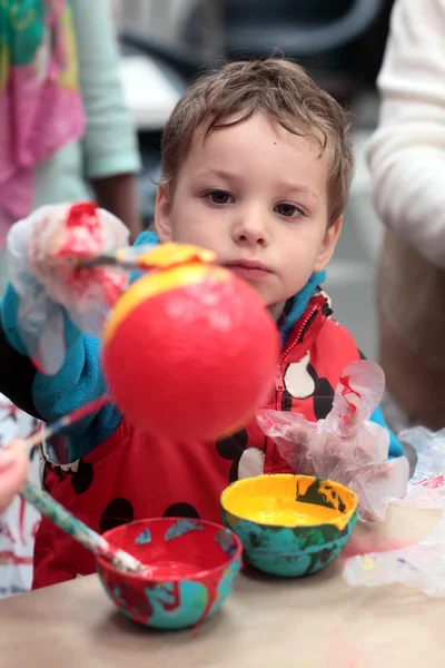 Boy decorating ball — Stock Photo, Image