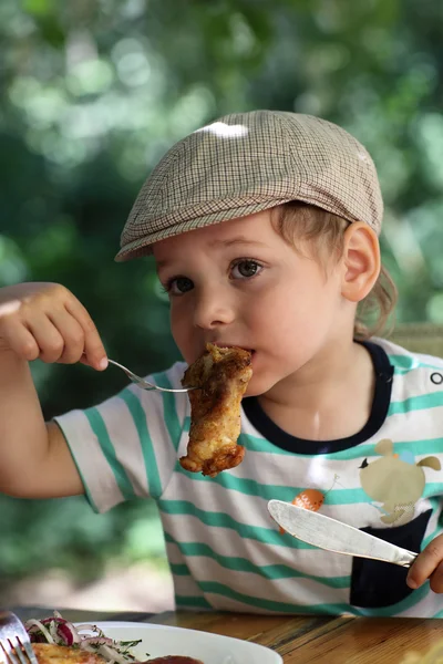 Boy has chicken — Stock Photo, Image