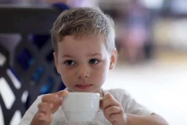 Child drinking tea — Stock Photo, Image