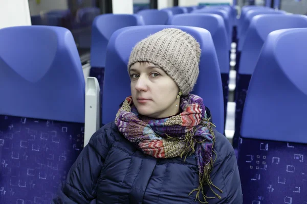 Serious woman in a train — Stock Photo, Image