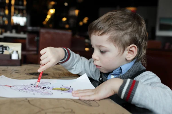 Child drawing at cafe — Stock Photo, Image