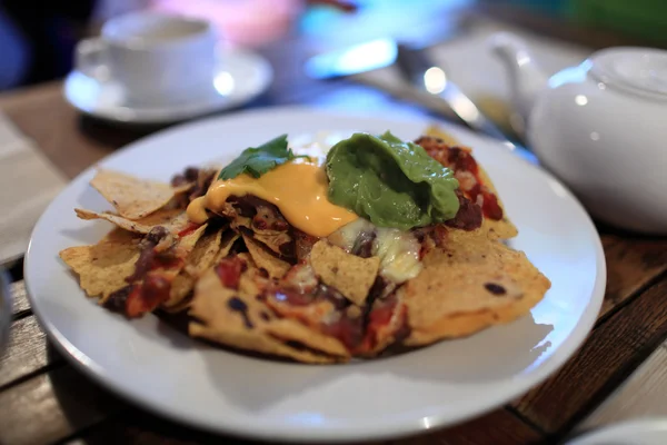 Plate with nachos and sauces — Stock Photo, Image