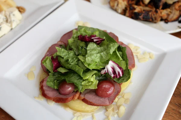 Salad with ham and lettuce — Stock Photo, Image