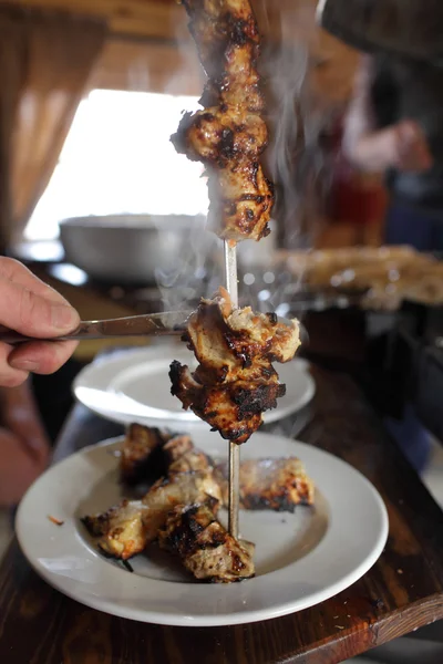 Person cooking kebab — Stock Photo, Image