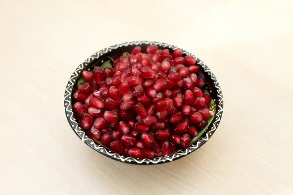 Pomegranate seeds on a plate — Stock Photo, Image