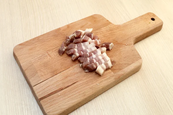 Slaná slanina na šachovnici — Stock fotografie