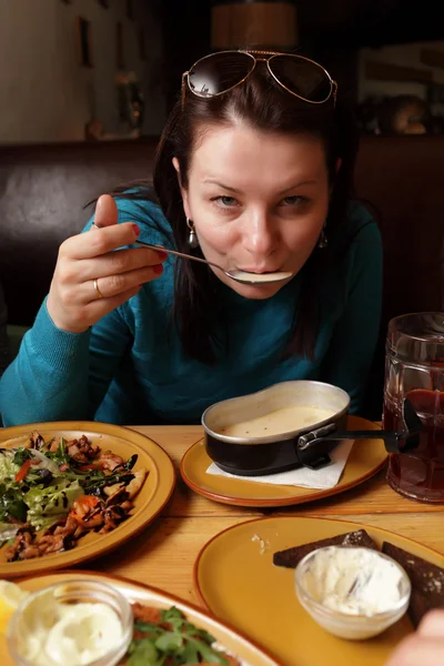 Woman eating soup — Stock Photo, Image