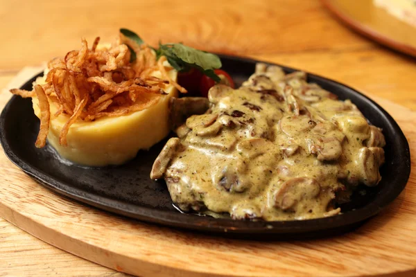 Plate of pork chops baked with onions — Stock Photo, Image