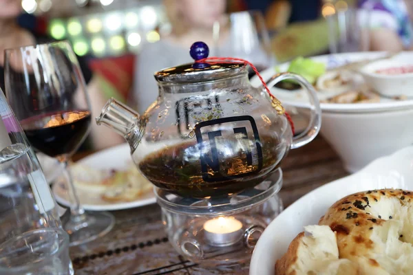 Glass teapot in the restaurant — Stock Photo, Image