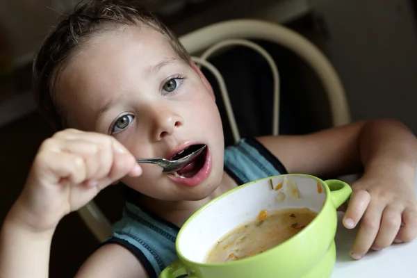 Boy eating soup — Stock Photo, Image