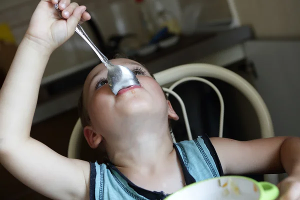 Kid eating soup — Stock Photo, Image
