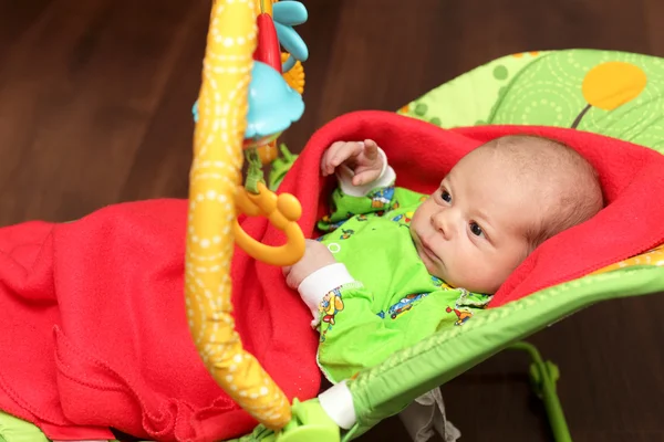 Newborn in the rocking chair — Stock Photo, Image