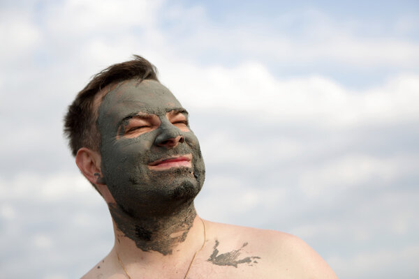 Man with black healthy mud