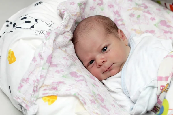 Newborn lying on the bed — Stock Photo, Image