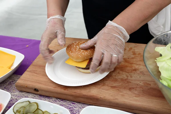 Cooking of burgers Stock Picture