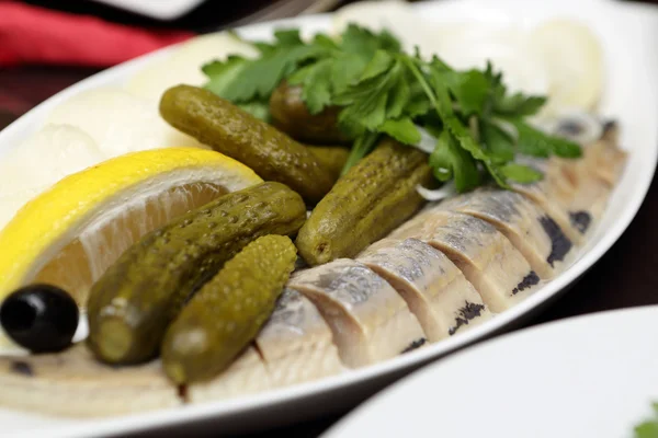 Salted herring with pickles — Stock Photo, Image