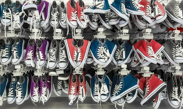 Many pair of sneakers in a store. — Stock Photo, Image