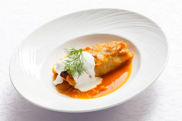 Stuffed cabbage leaf on plate — Stock Photo, Image