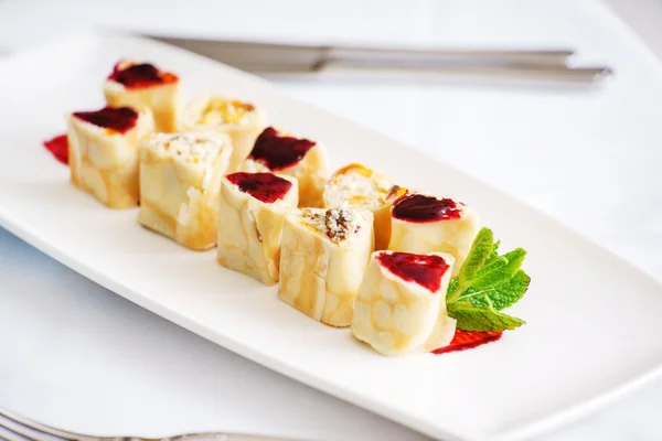 Sweet rolls on plate — Stock Photo, Image