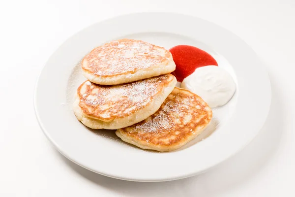 Tasty pancakes with sour cream — Stock Photo, Image