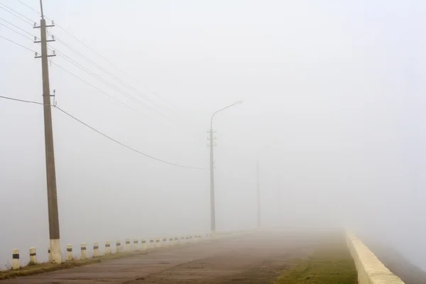 Road with autumn fog — Stock Photo, Image