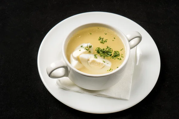 Broth with egg in plate — Stock Photo, Image