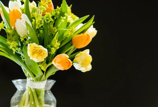 Spring flowers on black — Stock Photo, Image