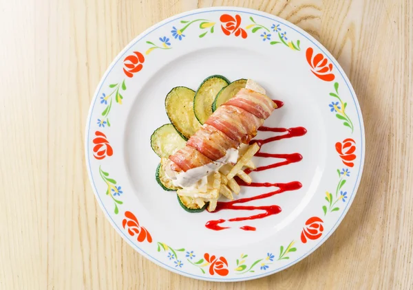 Chicken roll in strips of bacon — Stock Photo, Image
