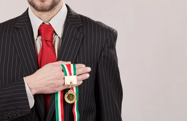 Successful businessman with medal — Stock Photo, Image