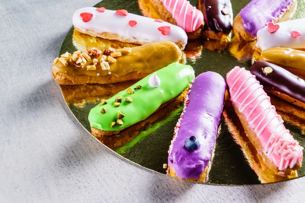 Tasty colorful eclairs — Stock Photo, Image